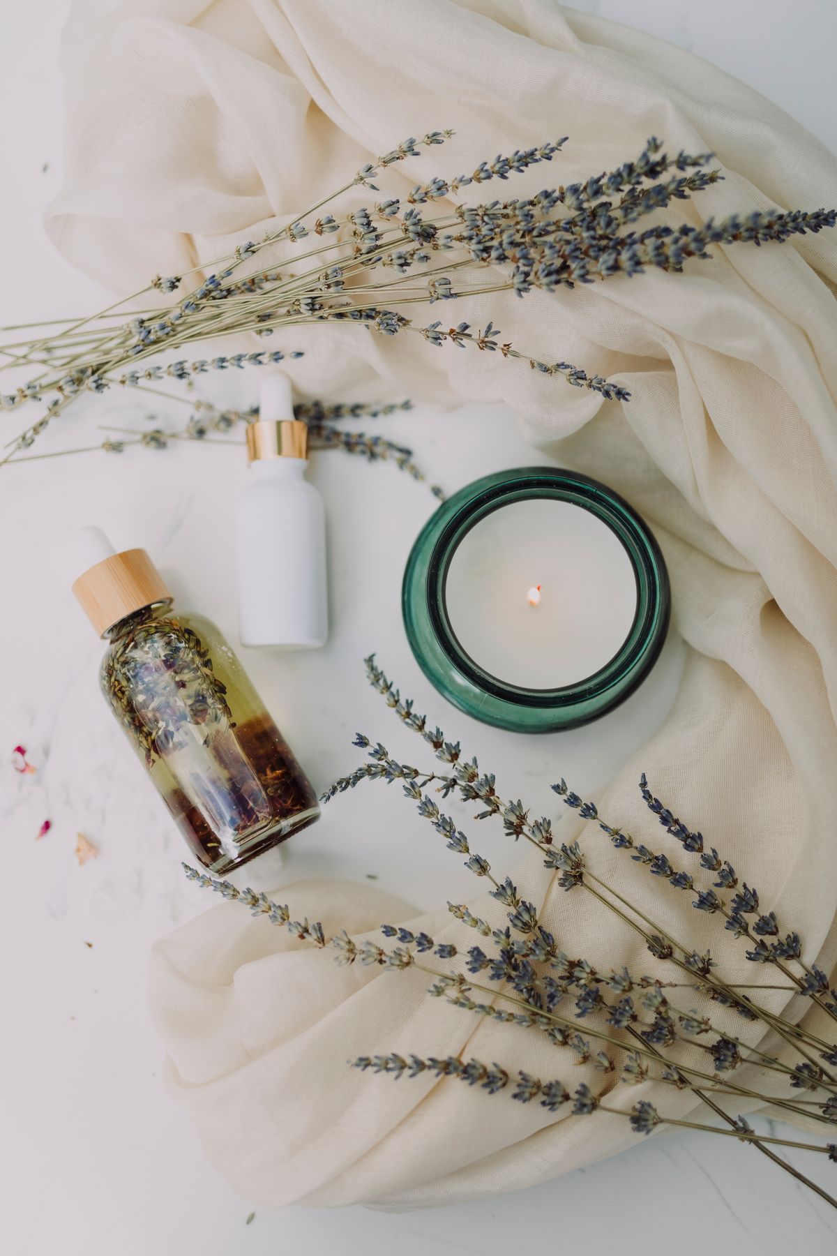 Calming spa setting with candle and lavender